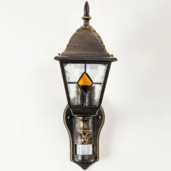 Luminaires Rustiques-hofstein Applique murale d'extérieur Antibes Brun doré, 1 lumière, Détecteur de mouvement