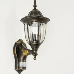 Luminaires Rustiques-hofstein Applique murale d'extérieur Ribadeo Noir doré, 1 lumière, Détecteur de mouvement