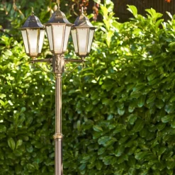 Luminaires Rustiques-hofstein Réverbère Hongkong Frost Brun doré, 3 lumières